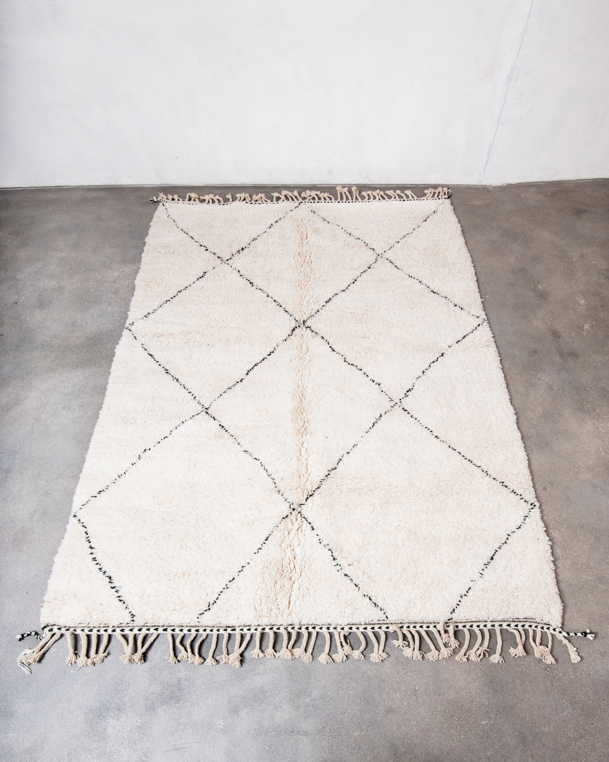 Modern, designer, handcrafted Berber rug from Morocco. Beniourain carpet with minimalist design, natural wool pile and a fluffy texture.